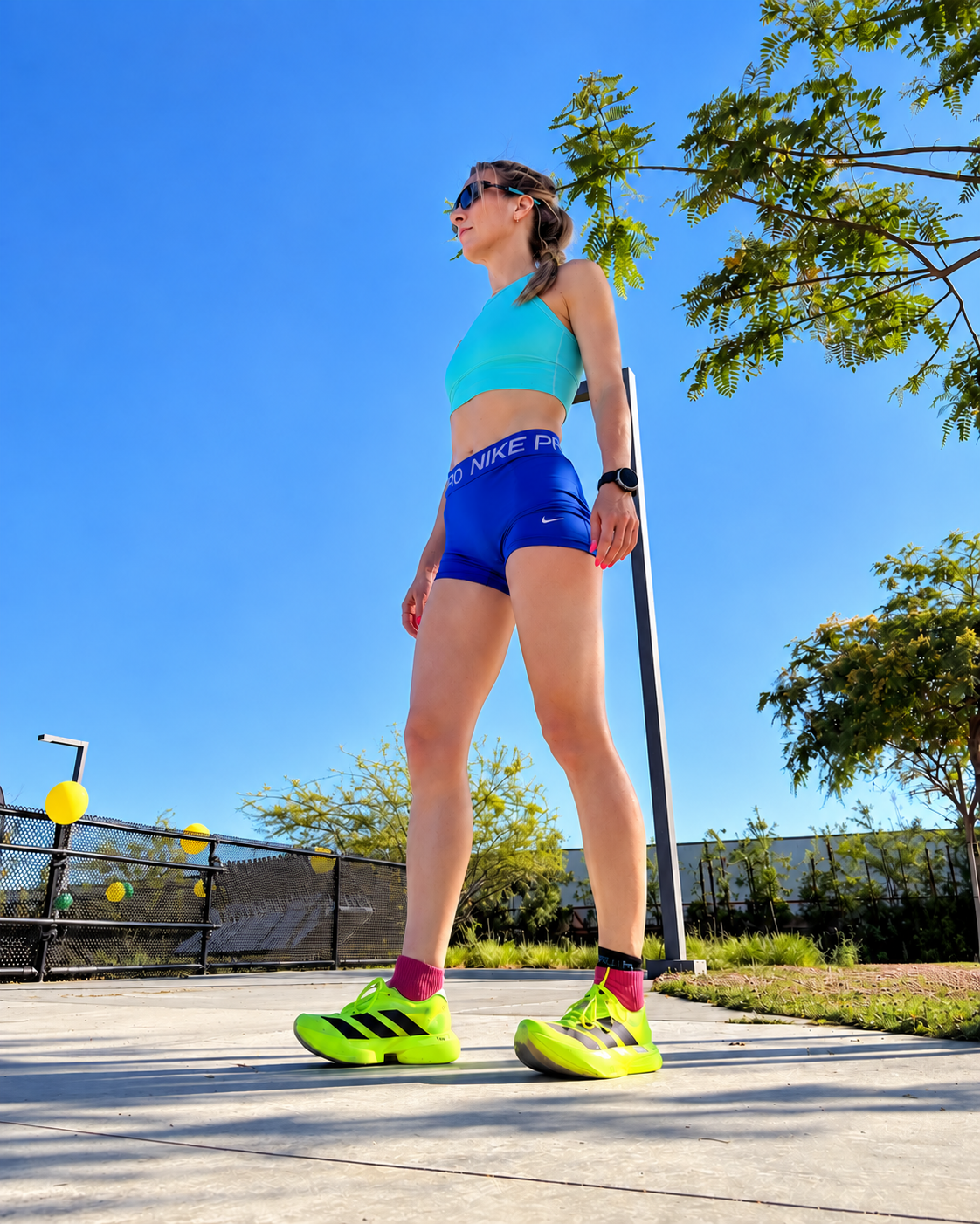 Nicci outdoors in running gear